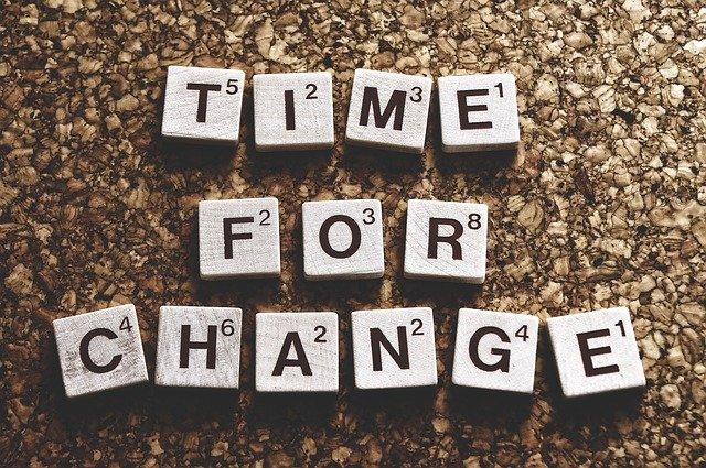 Time for change” spelled with Scrabble tiles, symbolizing website redesign tips for 2022.