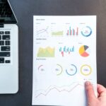 Free Person Holding Chart And Bar Graph Stock Photo