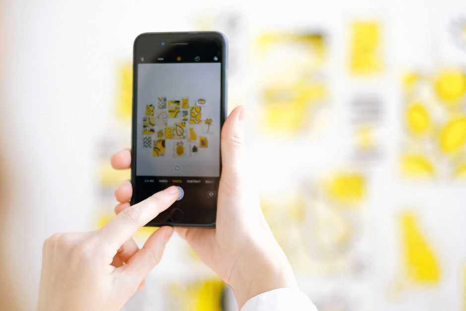 Taking photos with a smartphone — the library can stay complete while its storage footprint shrinks