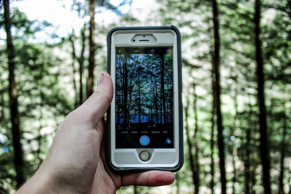 Person choosing camera settings on a smartphone screen